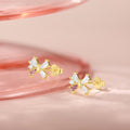dainty butterfly or bow shaped stud earrings with crystals