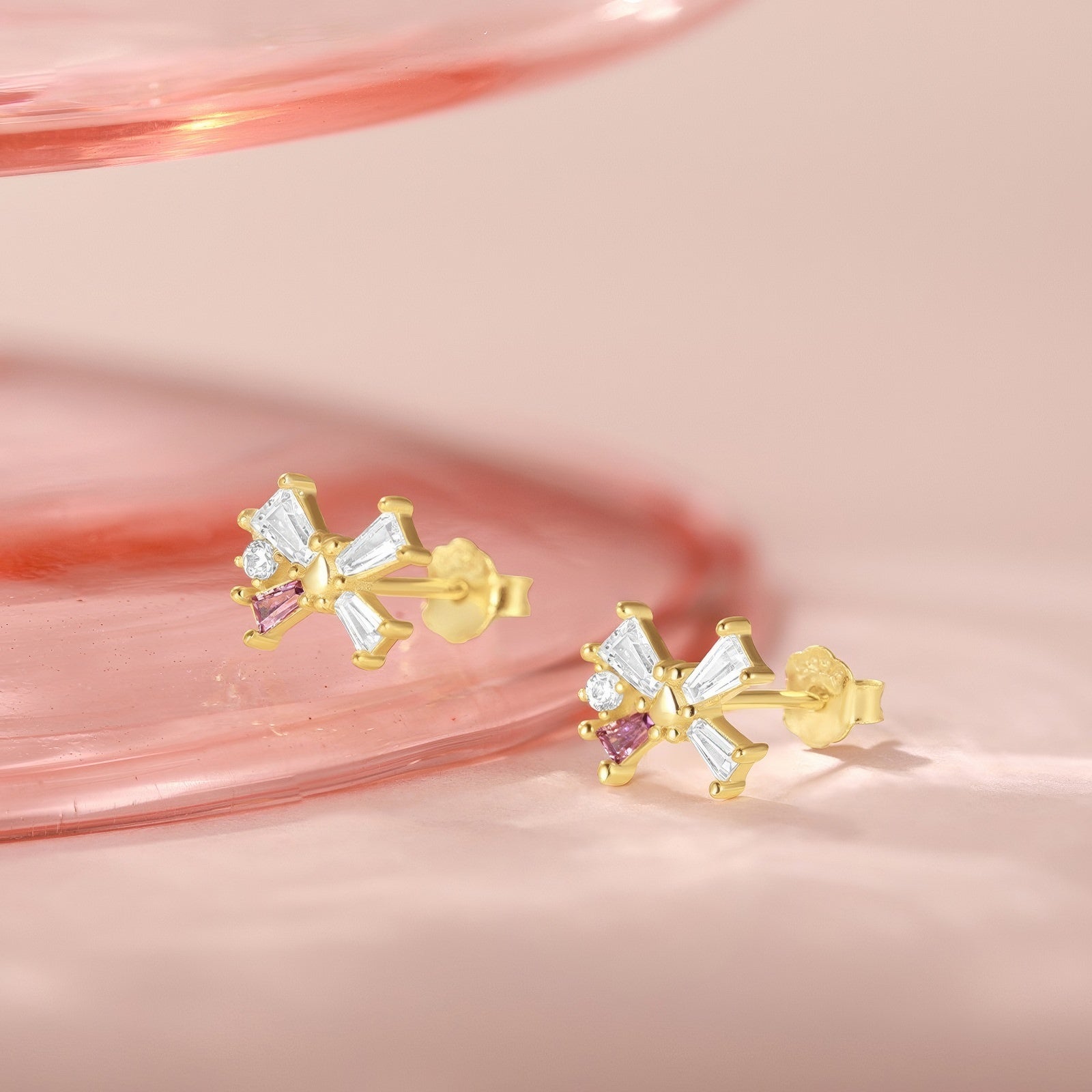 dainty butterfly or bow shaped stud earrings with crystals