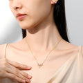 dainty gold plated bow shaped pink zirconia stone stud earrings