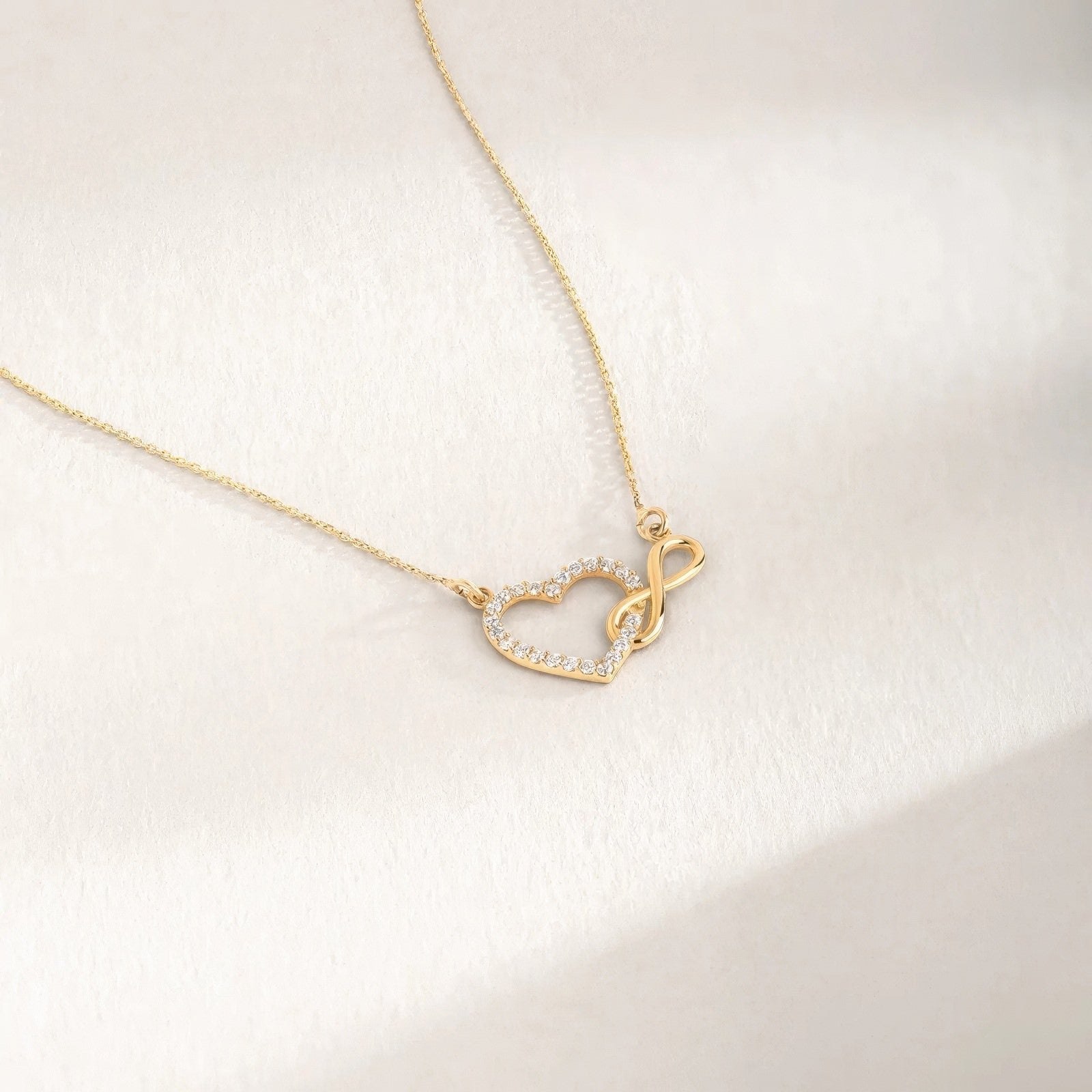infinity heart adorned with crystals and polished infinity sign pendant necklace
