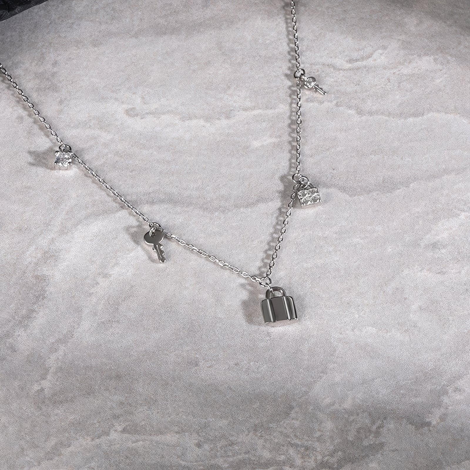 key and locker charms necklace with zirconia accents in gold plated