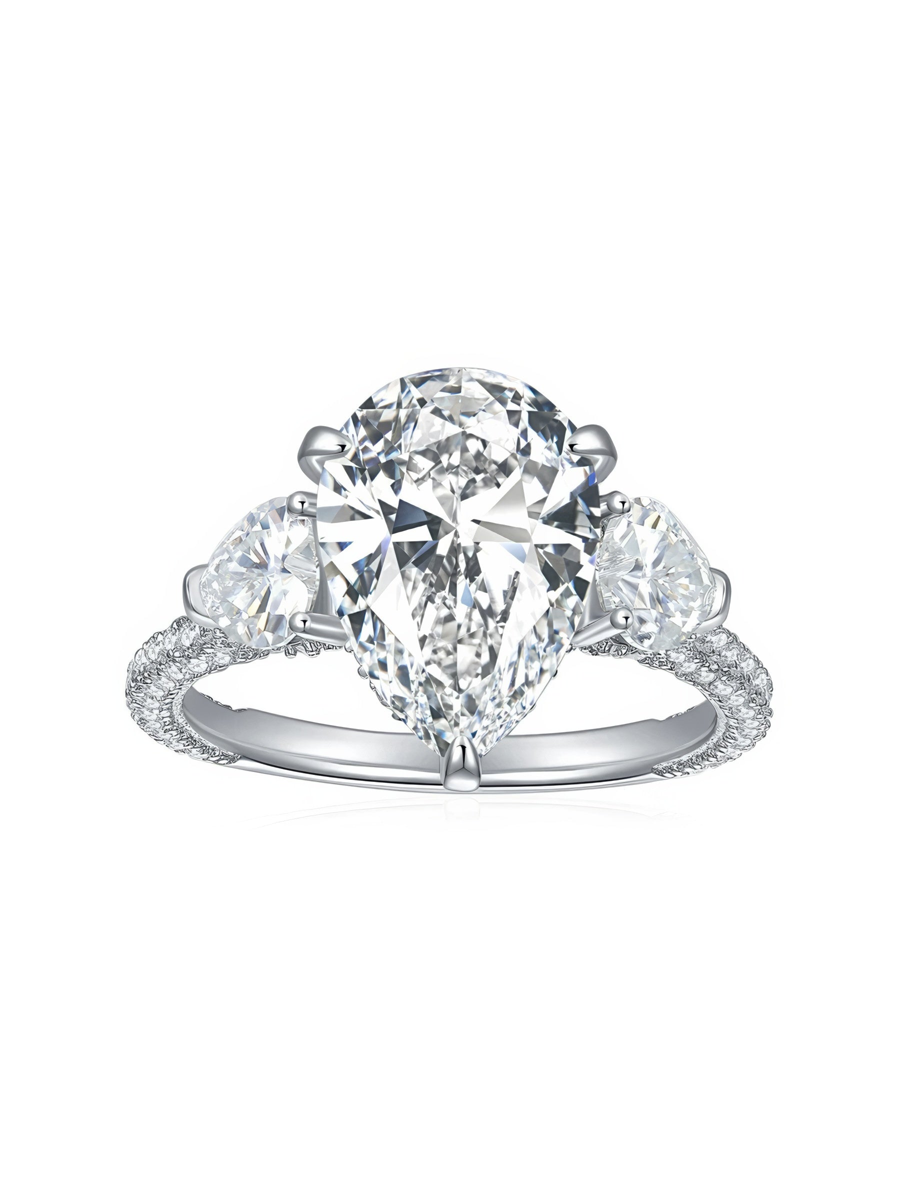 Sterling silver engagement ring with large pear-shaped moissanite center stone and heart-cut side stones, detailed with round moissanite on the band.
