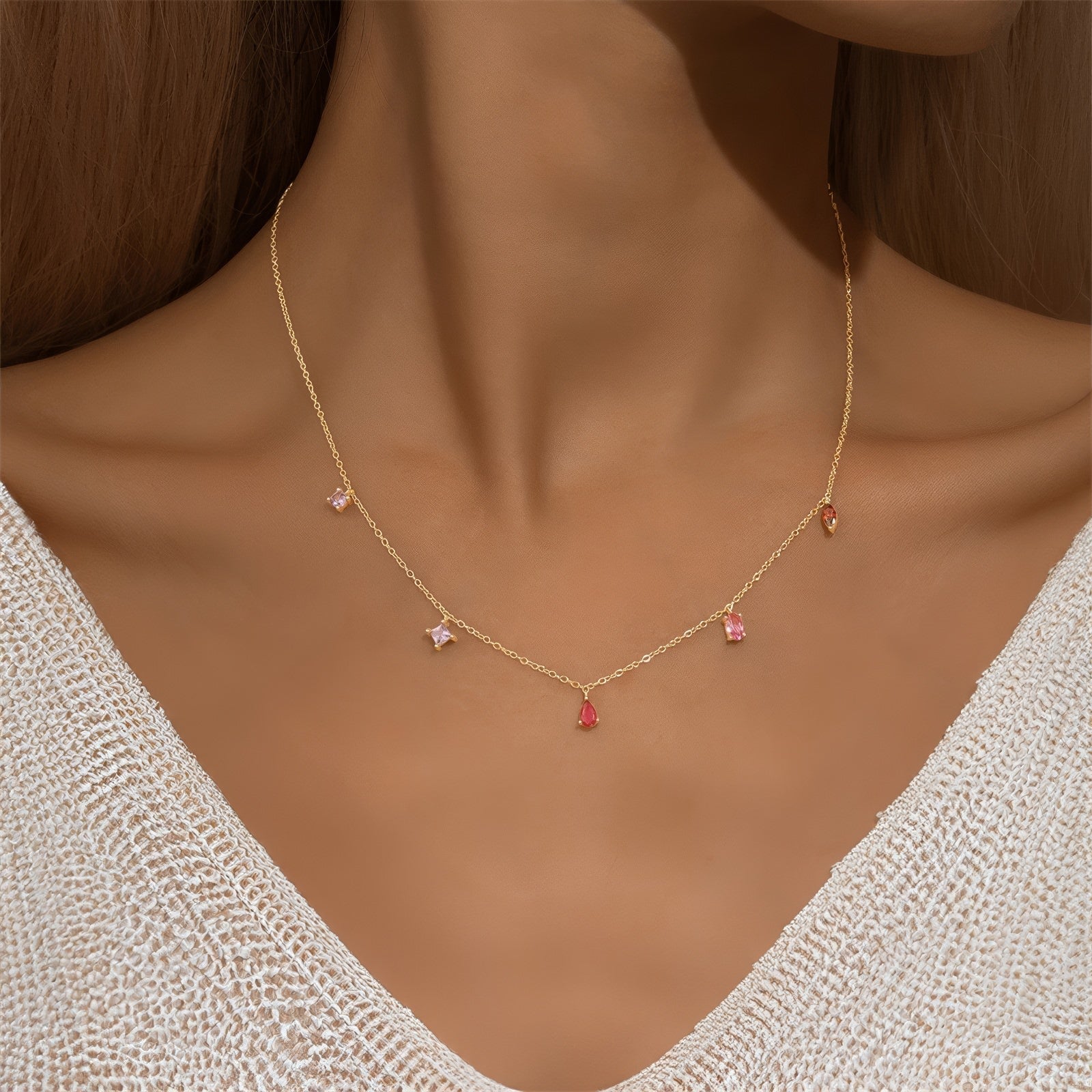 V-shape multicolor zirconia drop necklace in 925 sterling silver with 18K gold plating, adjustable chain, featuring red teardrop, pink baguette, marquise red, and purple square zirconia charms