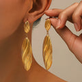 brushed texture long feather shaped gold plated dangle earrings