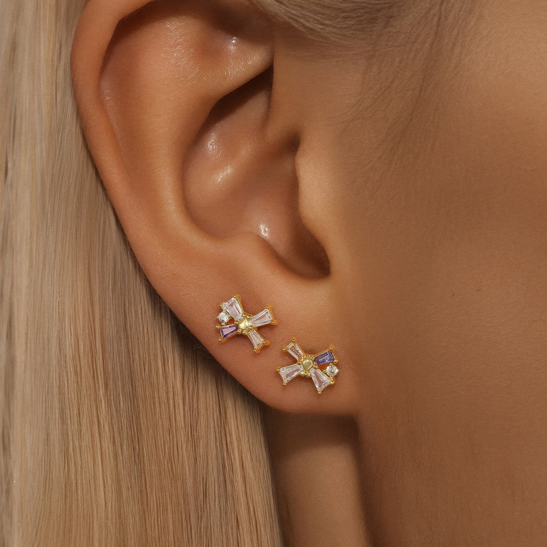 dainty butterfly or bow shaped stud earrings with crystals 