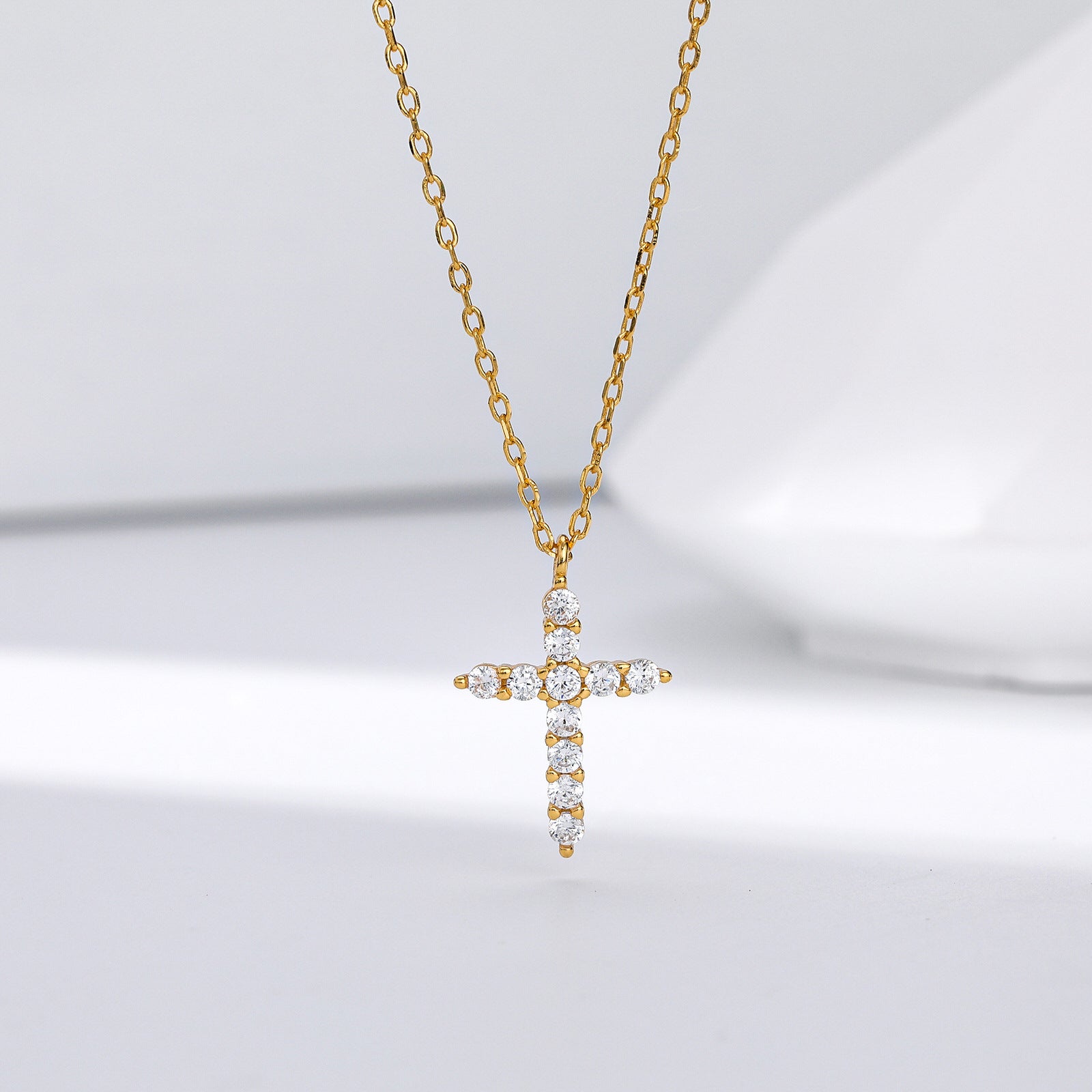Gold plated sterling silver cross pendant necklace with clear zircon stones on fine chain, minimal design jewelry cross piece