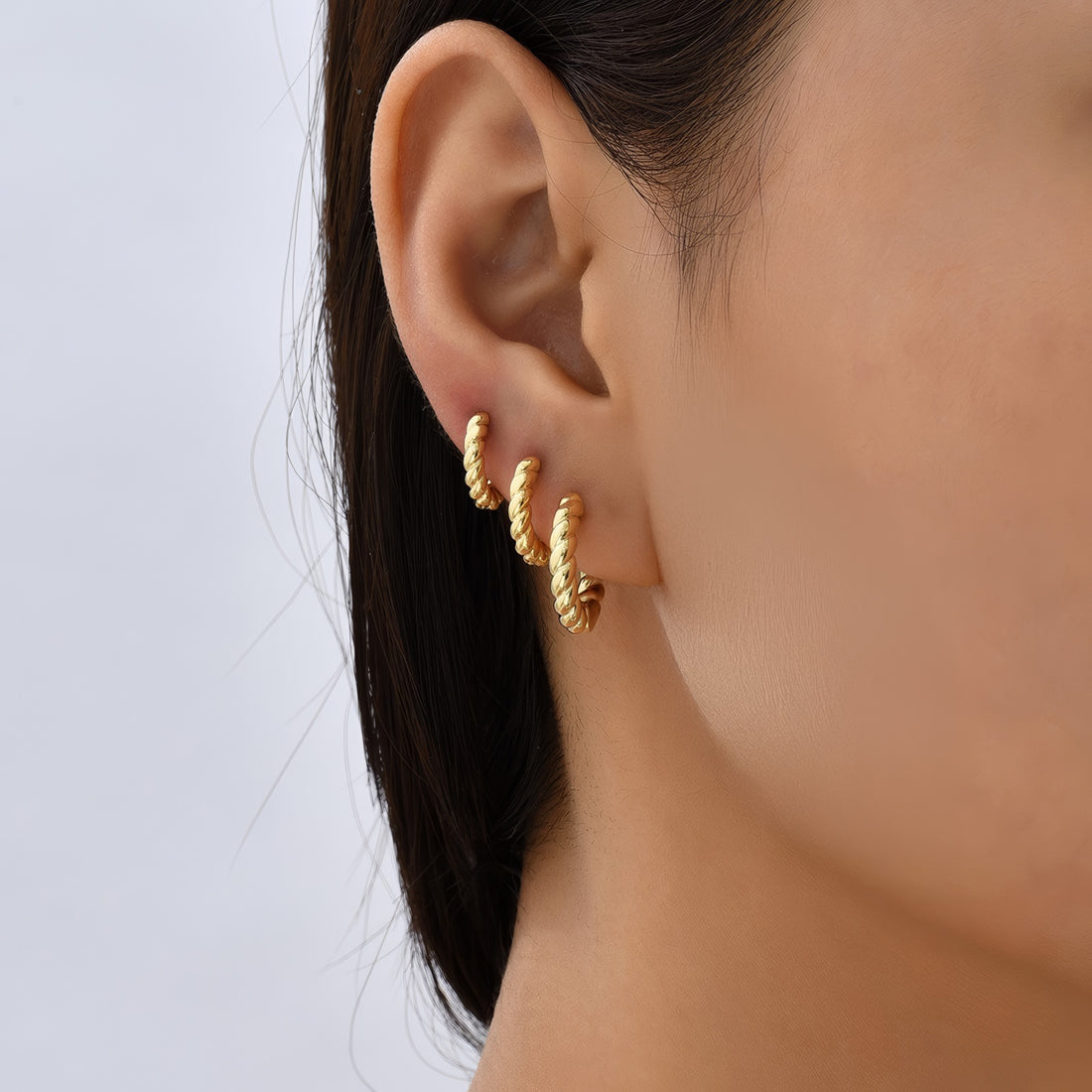 gold plated silver sculpted cable twisted huggie hoop earrings