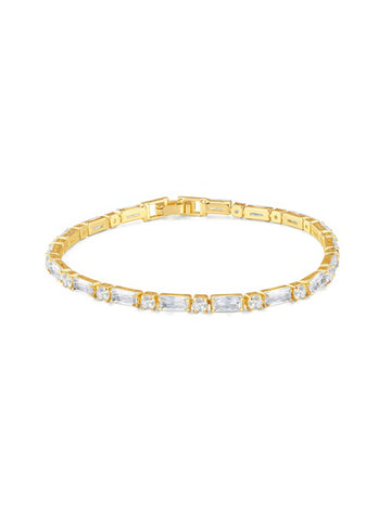 Gold tennis bracelet with alternating baguette and round zircon stones, 18K gold plated on copper, 3.5mm wide and 17cm long.