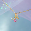 butterfly shaped pendant necklace pink and clear cubic zirconia crystal inclusions in gold plated cooper