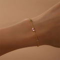 Gold-plated bracelet with pink heart-shaped zircon and multicolor zircon stones on a sterling silver chain.