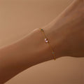 Gold-plated bracelet with pink heart-shaped zircon and multicolor zircon stones on a sterling silver chain.