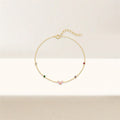 Gold-plated bracelet with pink heart-shaped zircon and multicolor zircon stones on a sterling silver chain.