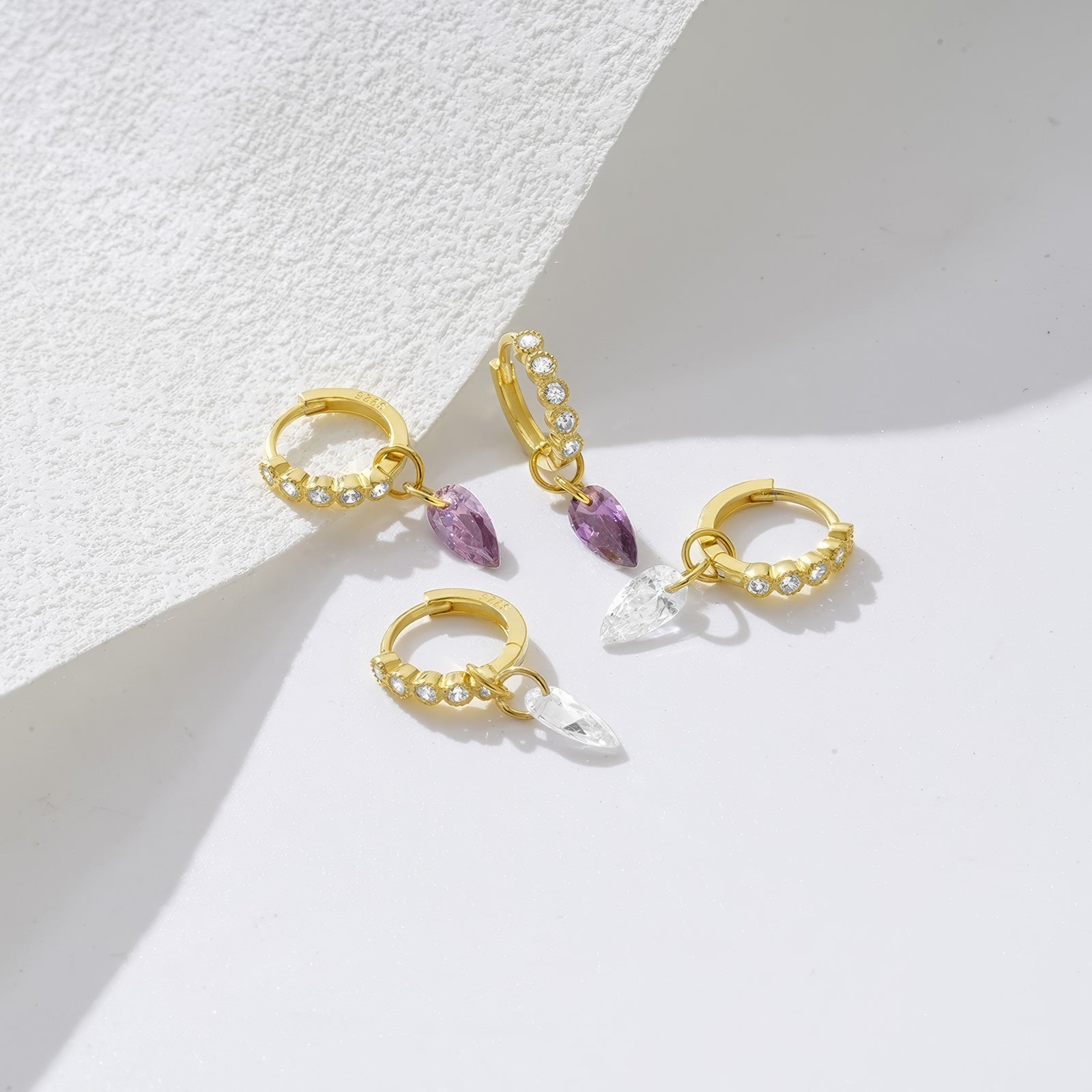 teardrop zirconia crystal pendant hoop earring adorned with small crystals in sterling silver and 18k gold plating