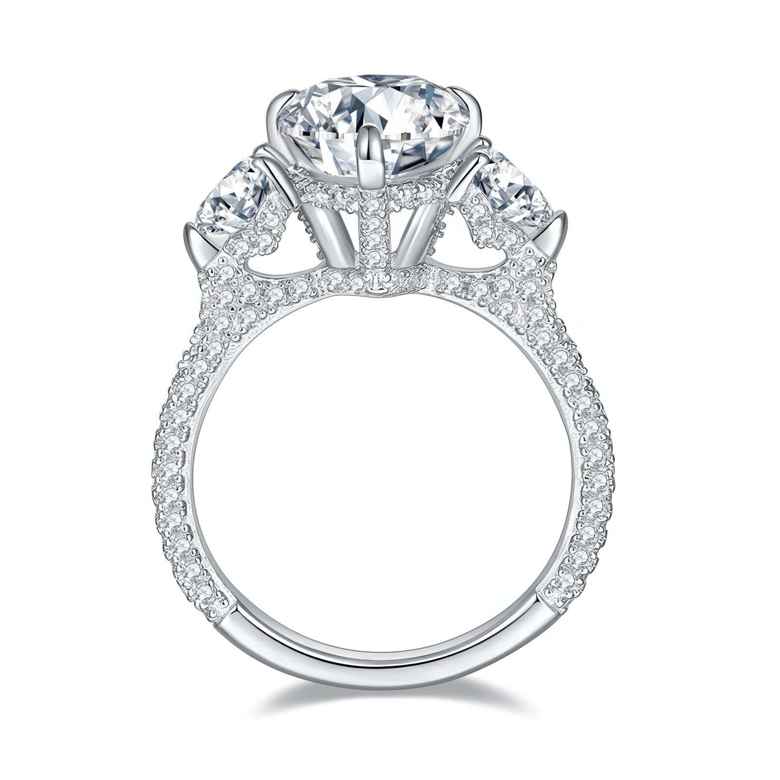 Sterling silver engagement ring with large pear-shaped moissanite center stone and heart-cut side stones, detailed with round moissanite on the band.